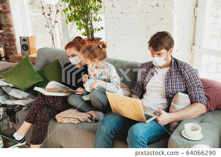 Caucasian family in protective masks and gloves isolated at home with coronavirus symptoms, treatment Caucasian family in protective masks and gloves isolated at home with coronavirus symptoms, treatment 64066290