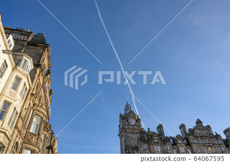 European clock tower and contrail European clock tower and contrail 64067595