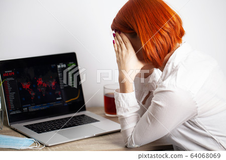 Woman with sadness watching the map of the spread of the coronavirus world 64068069