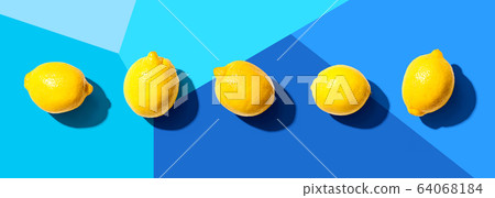 Fresh yellow lemons overhead view 64068184