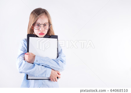 Young girl in glasses with clipboard in her hand against light grey background. 64068510