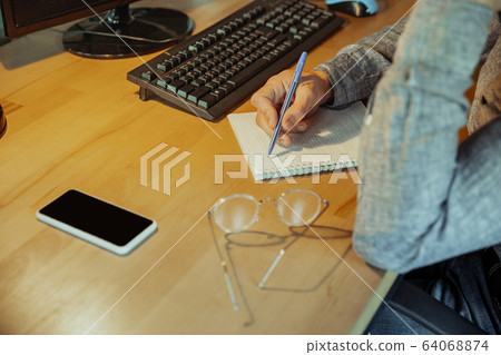 Man working from home during coronavirus or COVID-19 quarantine, remote office concept 64068874