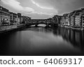Florence, Italy - 2020. View of medieval stone bridge Ponte Vecchio and the Arno River from the Ponte Santa Trinita. 64069317