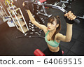 Young sport woman working out in gym. Healthy with 64069515
