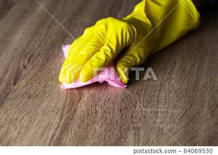 Closeup of a cleaning company worker cleans office 64069530