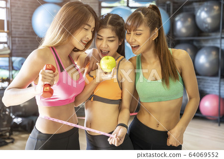 Portrait of happy young sport woman friends in gym. Portrait of happy young sport woman friends in gym. 64069552