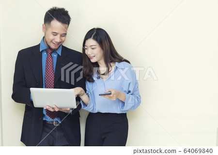 Two business people working and talking about job 64069840