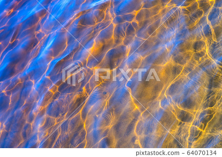 Glare of the sun and waves at the bottom of the river Glare of the sun and waves at the bottom of the river 64070134