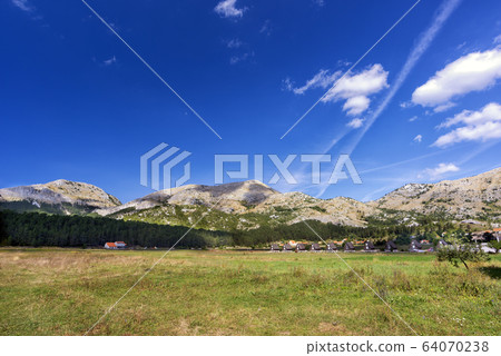 View of the village field and the Durmitor Mountains, national Park, Montenegro, Europe 64070238