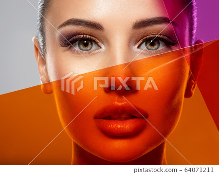 Beautiful white girl with bright eye-makeup. 64071211