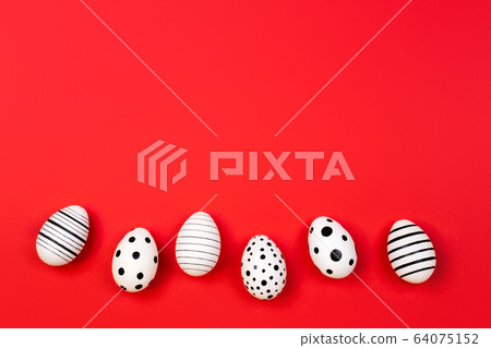 Different graphic hand-painted eggs on trendy coral background. Different graphic hand-painted eggs on trendy coral background. 64075152