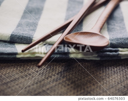 Korean traditional wooden spoon and wooden chopsticks background Korean traditional wooden spoon and wooden chopsticks background 64076303