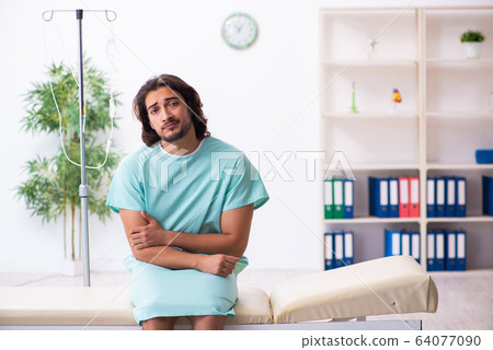 Young male patient in blood transfusion concept 64077090