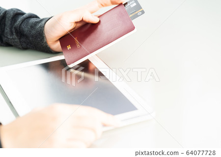 Close up of women hand holding passport with 64077728