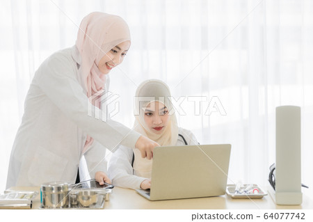 Woman doctor and muslim patient Woman doctor and muslim patient 64077742