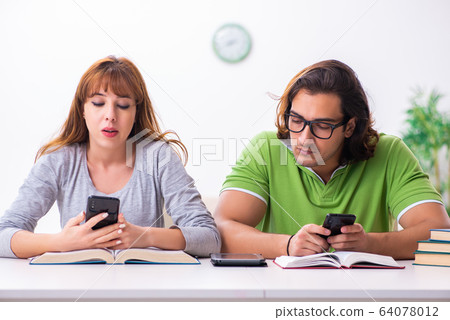 Two students in gadget dependency concept Two students in gadget dependency concept 64078012