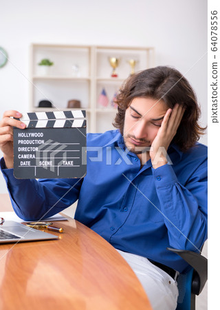 Movie director working in the studio 64078556