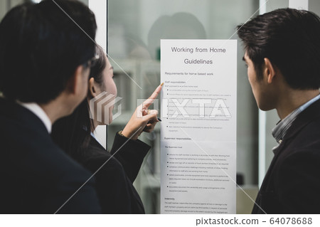 Businesspeople surrounded the placard board. Businesspeople surrounded the placard board. 64078688