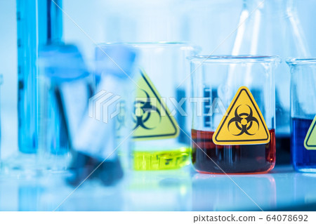 Blue water solution in glass 64078692