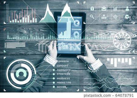 Business workplace with tablet device and media graphs and diagr Business workplace with tablet device and media graphs and diagr 64078791