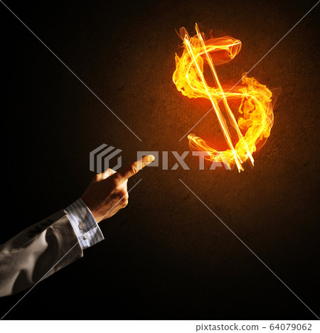 Concept of money making with dollar currency fire symbol on dark background Concept of money making with dollar currency fire symbol on dark background 64079062