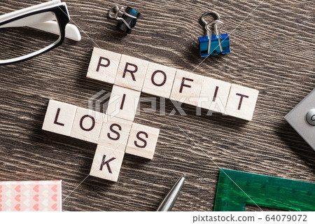 Conceptual business keywords on table with elements of game making crossword 64079072