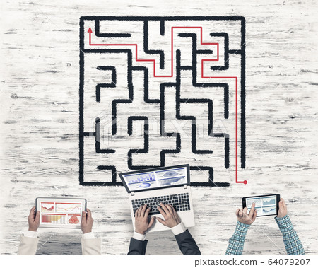 Top view of businesspeople sitting at table and using gadgets Top view of businesspeople sitting at table and using gadgets 64079207