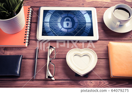 Web security and technology concept with tablet pc on wooden tab Web security and technology concept with tablet pc on wooden tab 64079275