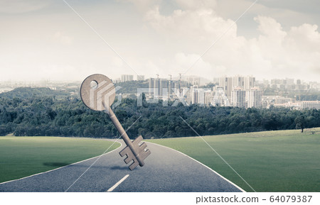 Conceptual background image of concrete key sign on asphalt road Conceptual background image of concrete key sign on asphalt road 64079387