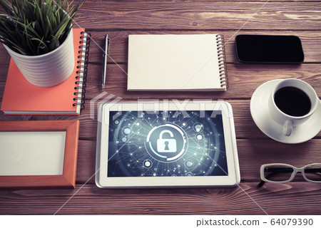 Web security and technology concept with tablet pc on wooden tab 64079390
