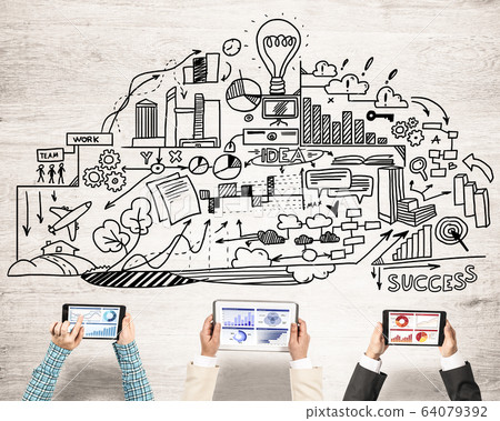 Top view of businesspeople sitting at table and using gadgets Top view of businesspeople sitting at table and using gadgets 64079392
