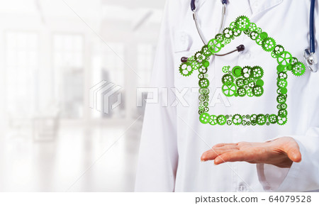 Symbol of homepage or accomodation made with cogwheels presented in female palms 64079528