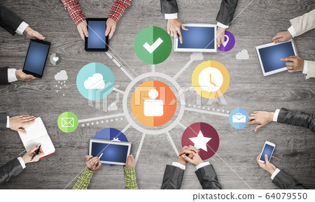 Top view of businesspeople sitting at table and using gadgets 64079550