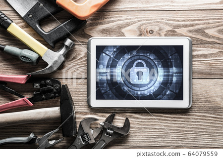 Web security and technology concept with tablet pc on wooden tab Web security and technology concept with tablet pc on wooden tab 64079559