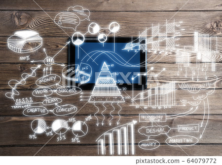 Concept of business strategy and planning with tablet on wooden table Concept of business strategy and planning with tablet on wooden table 64079772