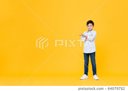 Smiling Asian boy doing arms crossed gesture with open palm Smiling Asian boy doing arms crossed gesture with open palm 64079782