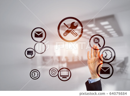 Modern office interior and close of businesswoman hand choosing symbol on application interface 64079884