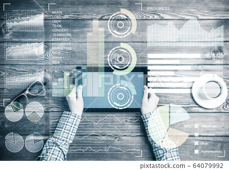 Business workplace with tablet device coffee cup and media graph Business workplace with tablet device coffee cup and media graph 64079992
