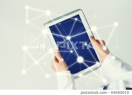 Close of female doctor hands working with tablet pc computer Close of female doctor hands working with tablet pc computer 64080019