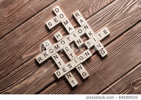 Conceptual business keywords on table with elements of game making crossword Conceptual business keywords on table with elements of game making crossword 64080020