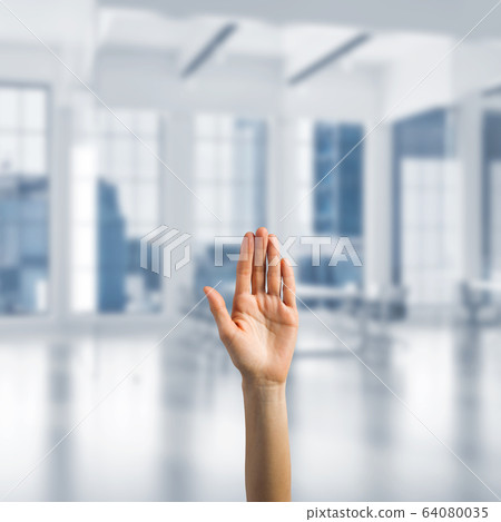 Choosing gesture of person in elegant modern interior in sunshine light Choosing gesture of person in elegant modern interior in sunshine light 64080035