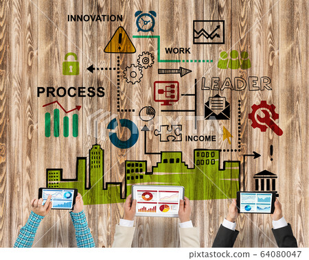 Top view of businesspeople sitting at table and using gadgets Top view of businesspeople sitting at table and using gadgets 64080047