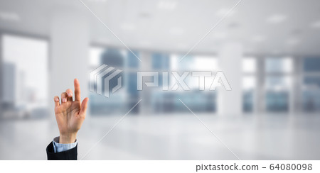 Choosing gesture of businessperson in elegant modern interior in sunshine light Choosing gesture of businessperson in elegant modern interior in sunshine light 64080098