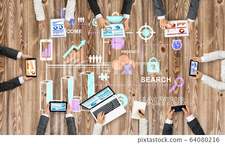 Top view of businesspeople sitting at table and using gadgets Top view of businesspeople sitting at table and using gadgets 64080216