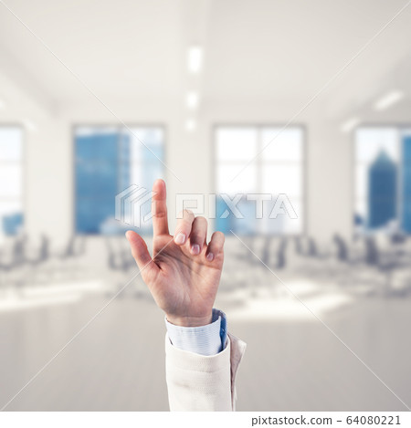 Choosing gesture of businessperson in elegant modern interior in 64080221