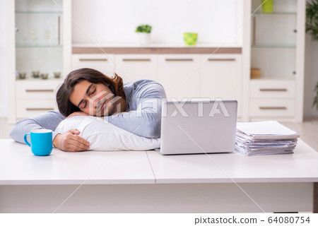 Young male employee freelancer working from home 64080754