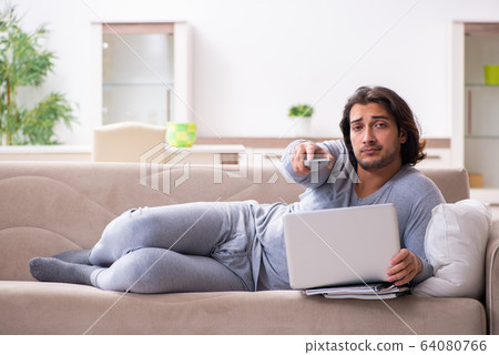 Young male employee freelancer working from home Young male employee freelancer working from home 64080766