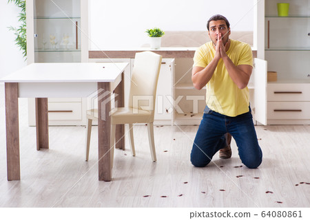 Young man and a lot of cockroaches at home Young man and a lot of cockroaches at home 64080861
