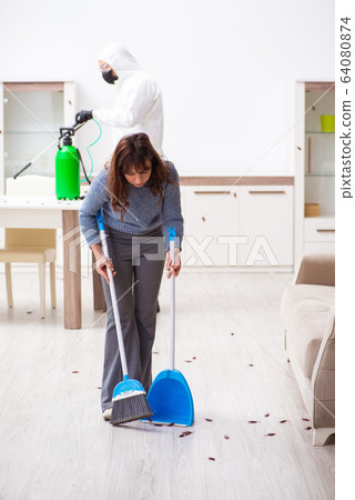 Young male contractor and female client during pest control Young male contractor and female client during pest control 64080874