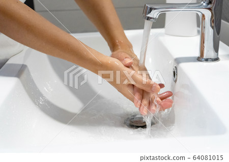 Washing hands rubbing with soap woman for corona 64081015